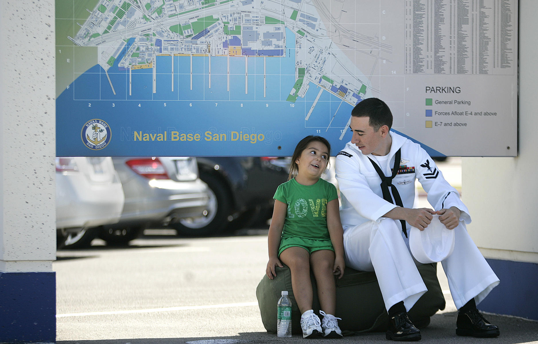 Sailor listens to niece speak about her life after he came back from his deployment, Naval Base, San Diego