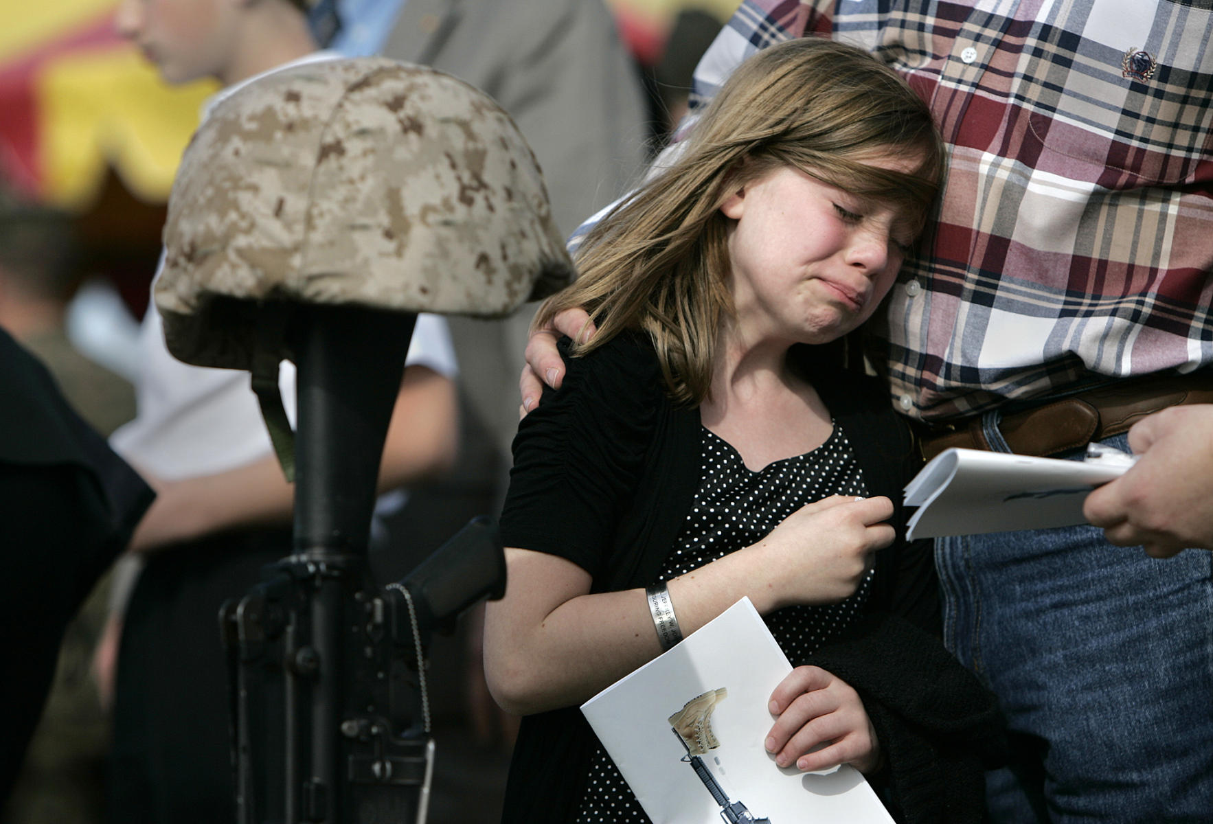 Little sister crying at Marine brother's memorial service, Camp Pendleton, CA