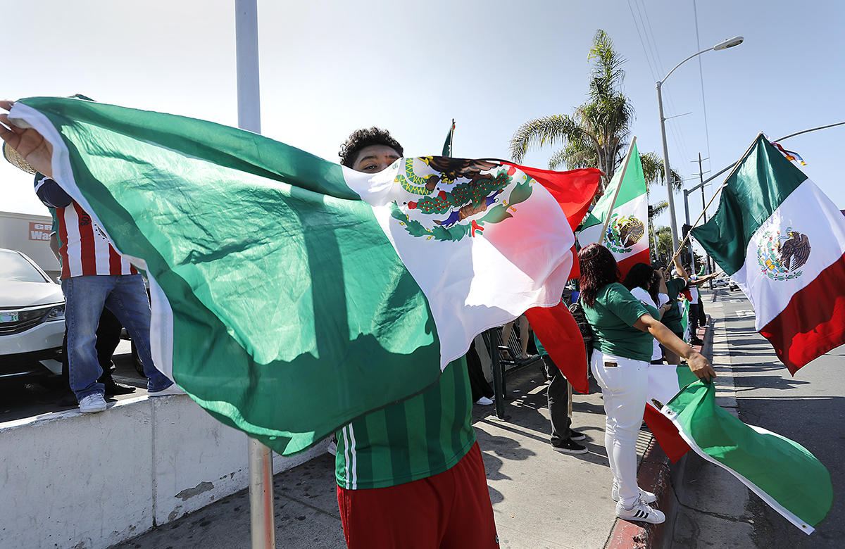 National City Mexican-Americans celebrate as Mexico advances in World Cup soccer. 