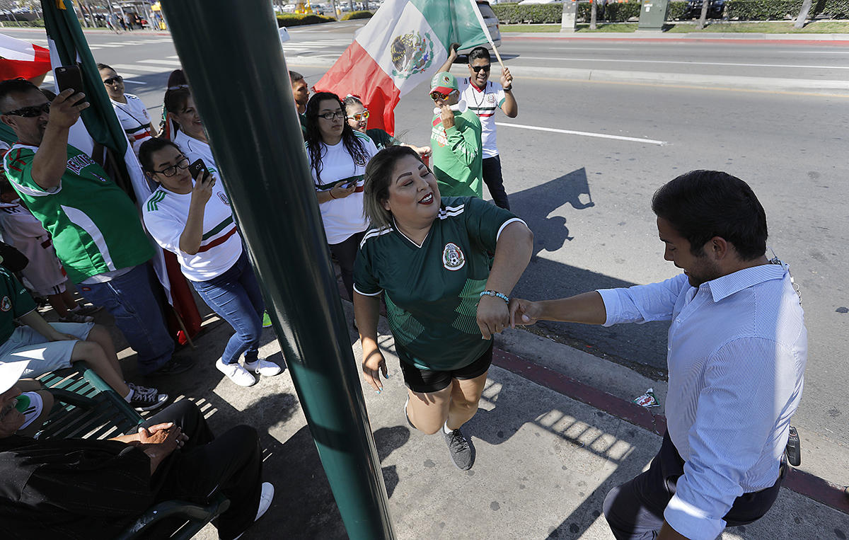 National City Mexican-Americans celebrate as Mexico advances in World Cup soccer. 