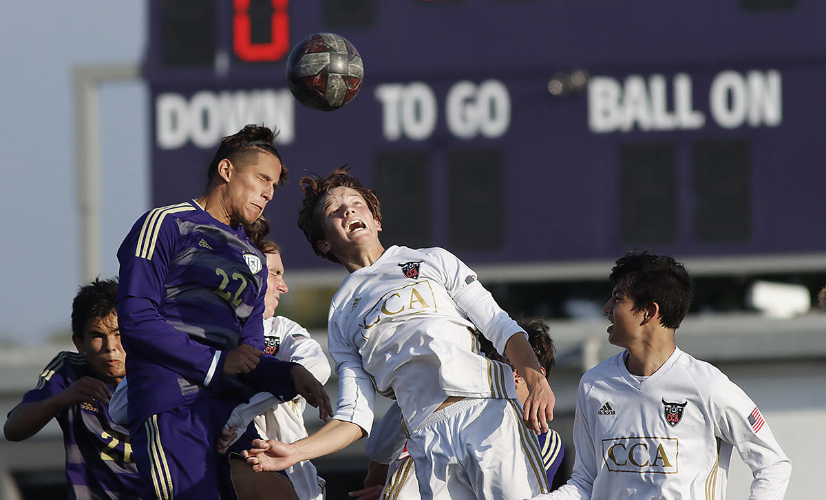 In a February matchup St. Augustine and Canyon Crest players give it their all in soccer playoffs before going to distance learning and the absence of physical competition. 