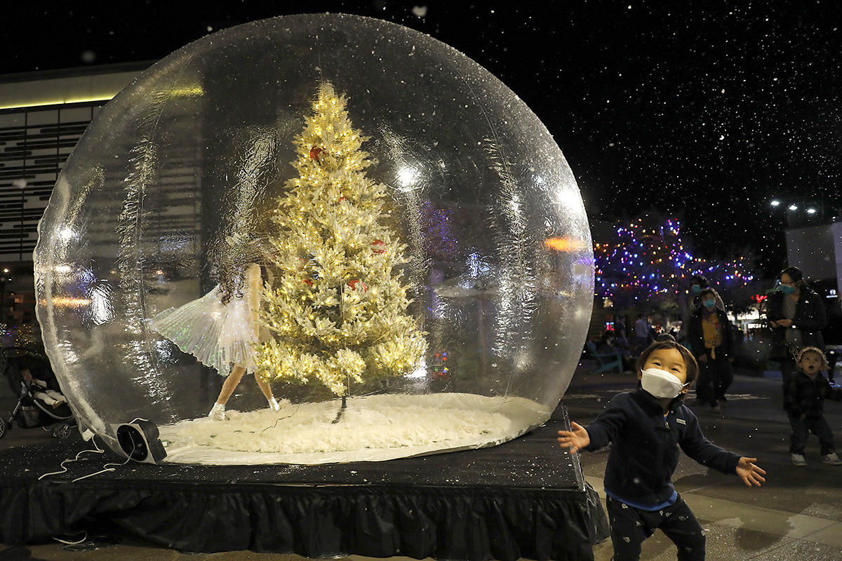 Away from the politics, but still affected by COVID, a local shopping mall decided on putting Santa and his elves in plastic globes for all to see.  