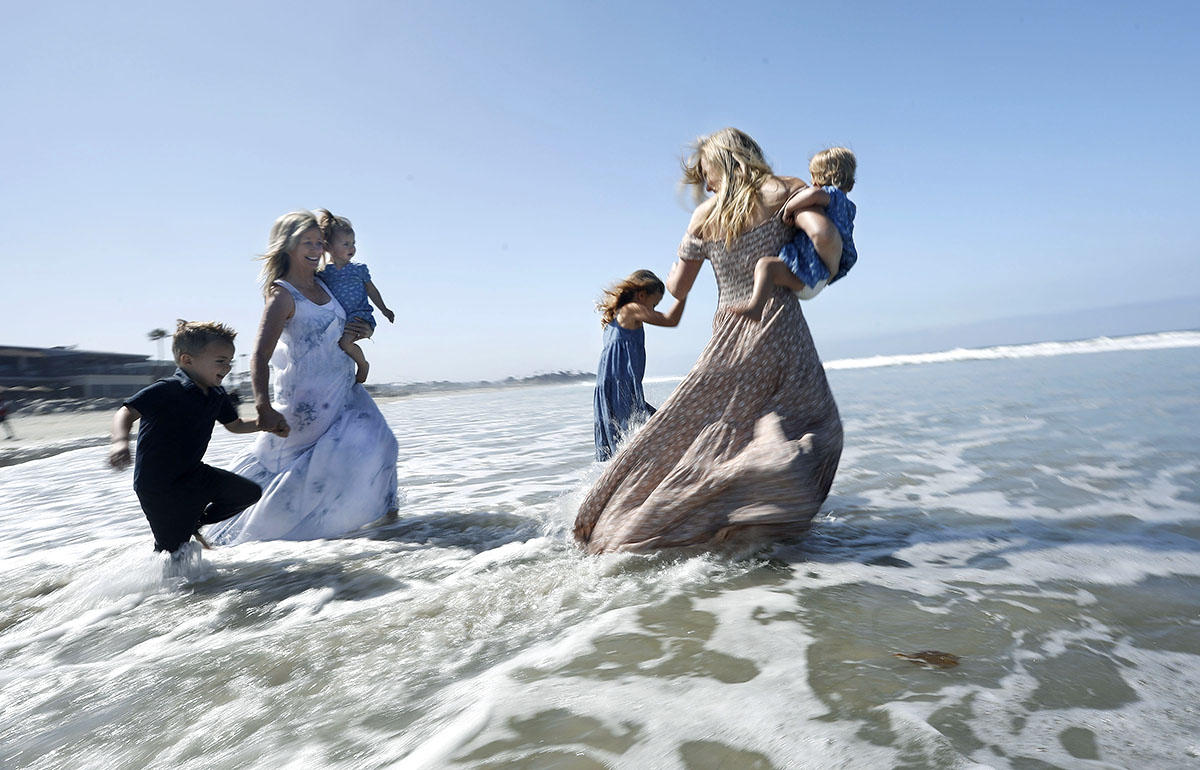 Mother's Day Fancy Dress Swim participants brave the Pacific in their dresses. 